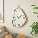 White Metal Abstract Wavy Decorative Wall Clock with Gold Frame and Black Accents